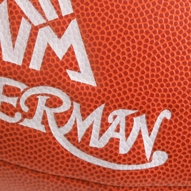 An American football in orange with textured surface and a white logo.