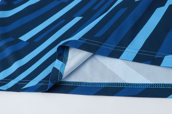 A blue and turquoise patterned polyester singlet with a smooth finish and neat stitching details.