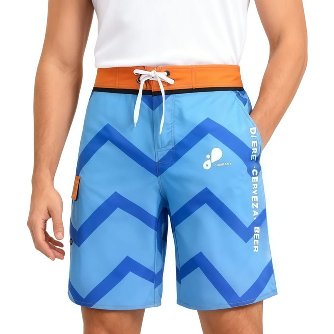 Knee-length men's swim shorts in blue with a zigzag pattern, featuring an orange waistband and a logo.