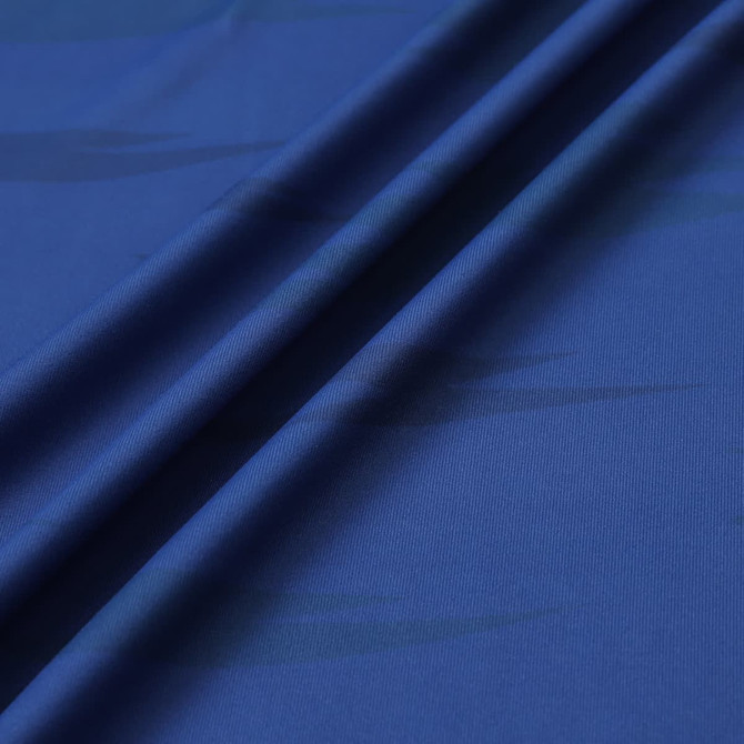 A close-up of blue polyester spandex fabric, showcasing its smooth texture and subtle patterns.