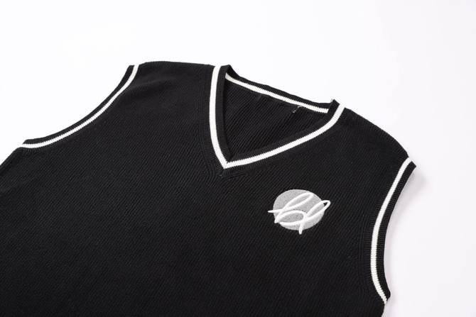 A black unisex cotton spandex V-neck knitted vest with a contrast knit trim and a logo on the chest.