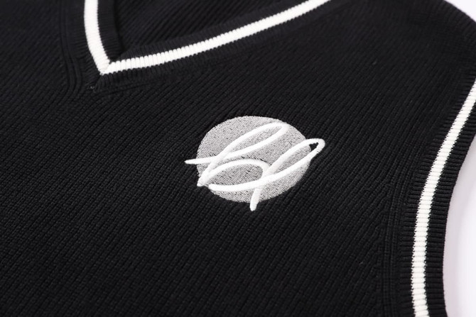 A black unisex cotton spandex V-neck knitted vest featuring a logo and contrasting white trim.