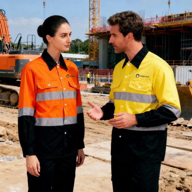 A unisex long-sleeve shirt in hi-visibility orange and yellow with black accents and reflective stripes, featuring a logo.