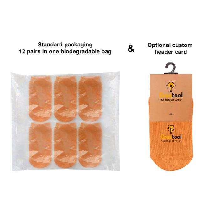A biodegradable bag containing 12 pairs of orange low cut kids' gripper socks, with an optional header card.