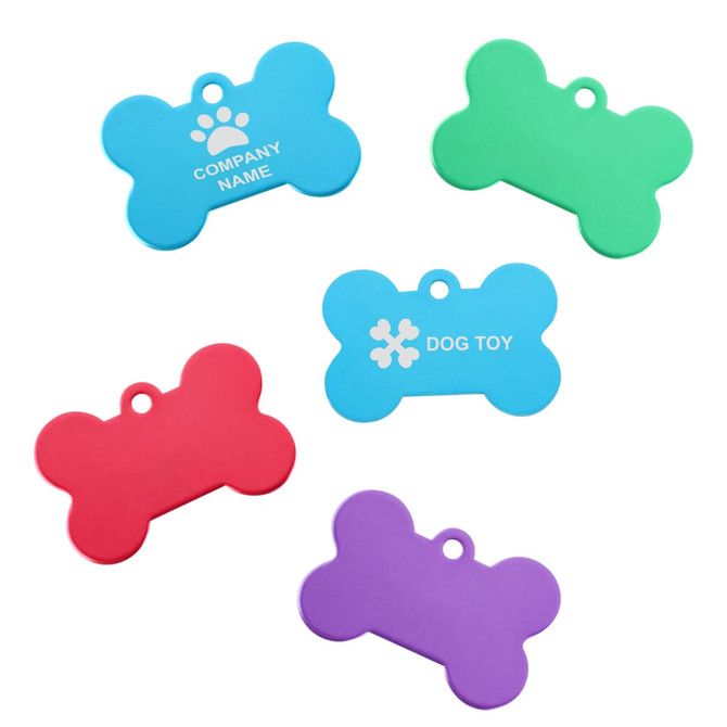 A selection of five bone-shaped pet ID tags in blue, green, red, and purple, featuring a logo on one tag.
