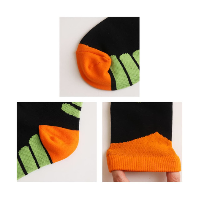 Crew sport socks featuring a black base with orange and green accents, including contrasting toe and cuff designs.
