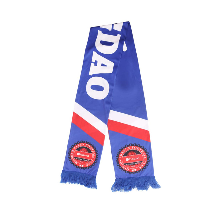 A blue and white knitted polyester scarf with red accents and tassels, featuring a logo.