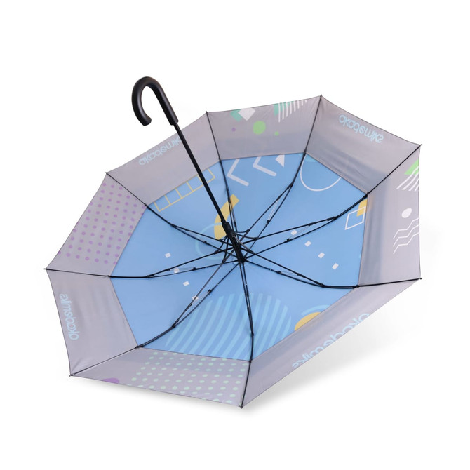 An expandable golf umbrella featuring a blue canopy with abstract patterns in various colours and a black handle.