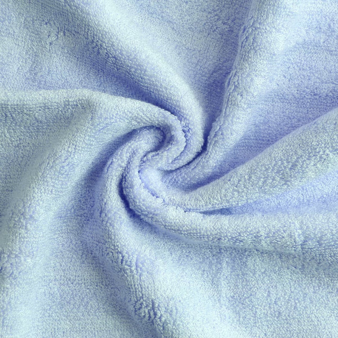 A light blue bamboo fiber towel, soft and plush, displayed in a spiralled layout, with visible texture.