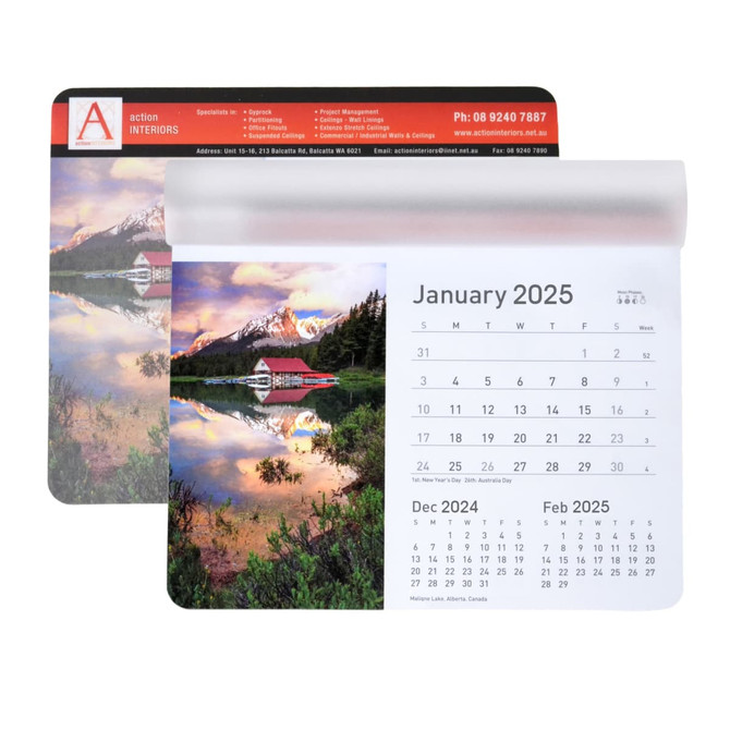 A mouse mat featuring a scenic landscape, including a lake, mountains, and a calendar for December 2024 to February 2025.