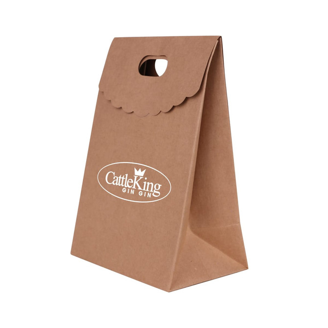 A brown die cut handle bag with a flap, featuring a decorative edge and a handle cut-out.