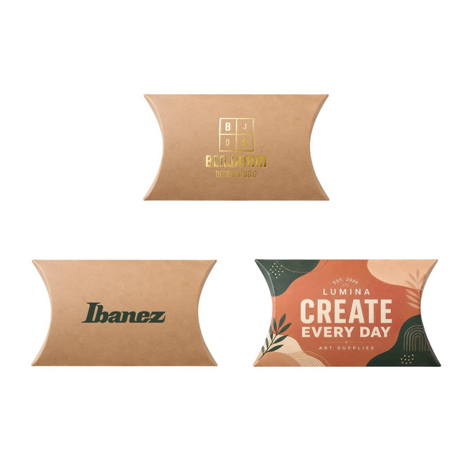 A small brown kraft pillow box featuring various designs and logos in gold and green on its surface.