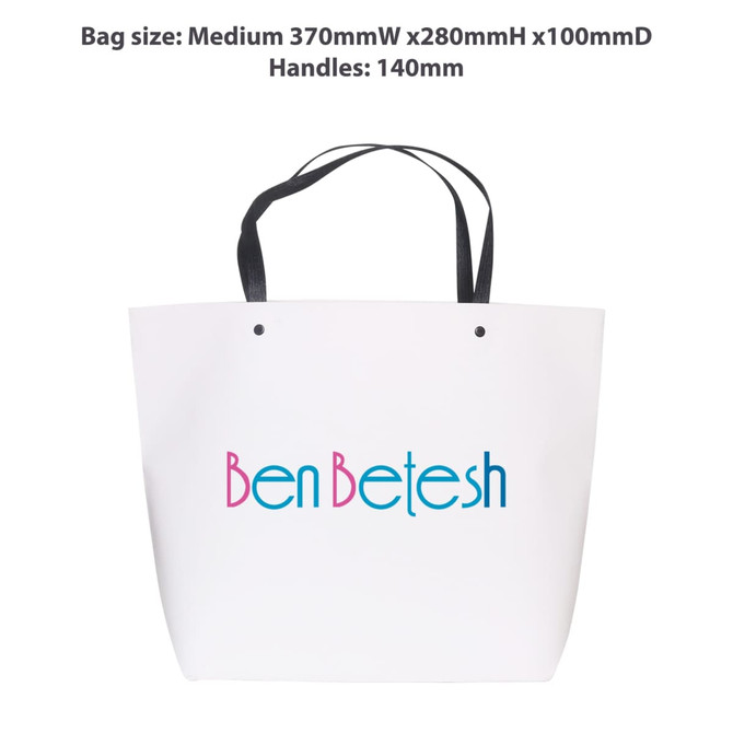 A medium white paper bag with a black handle, featuring a logo in blue and pink text. Dimensions are 370mm x 280mm x 100mm.