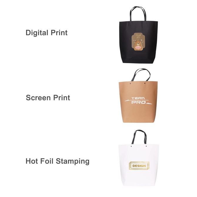 A large boutique paper bag available in black, brown, and white, featuring a logo or branding on each.