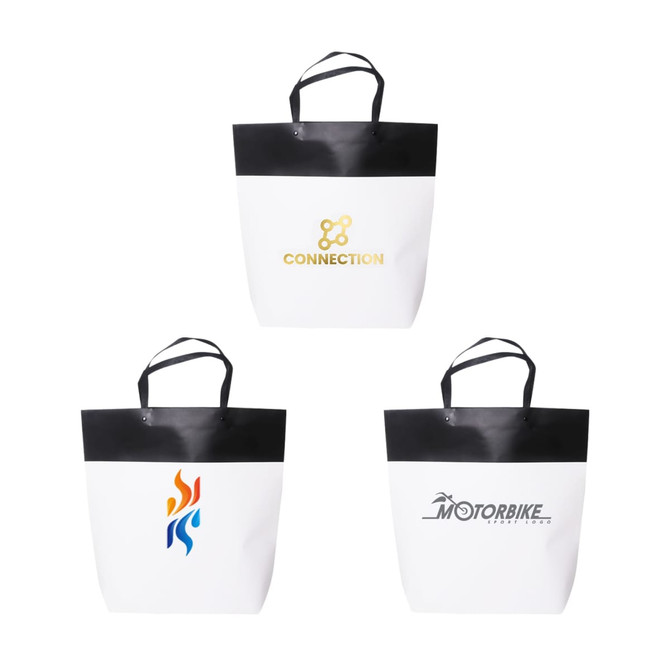 A large black and white paper bag featuring various designs and logos. It has two handles for carrying.