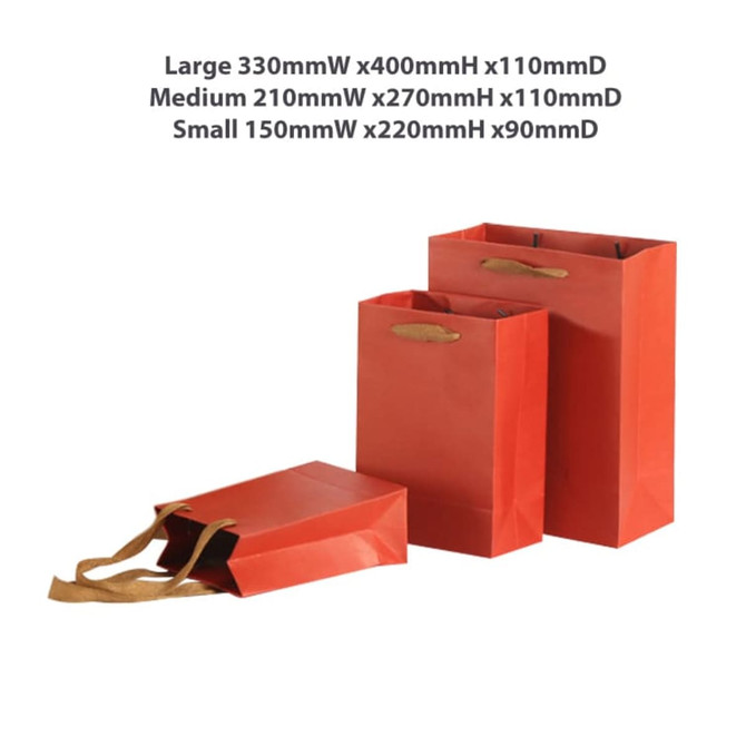 A set of three red paper bags in different sizes with fabric flat handles. One large, one medium, and one small.