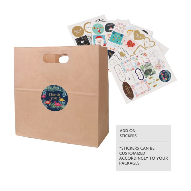 A brown kraft paper bag with a handle, featuring a circular logo and assorted decorative stickers beside it.