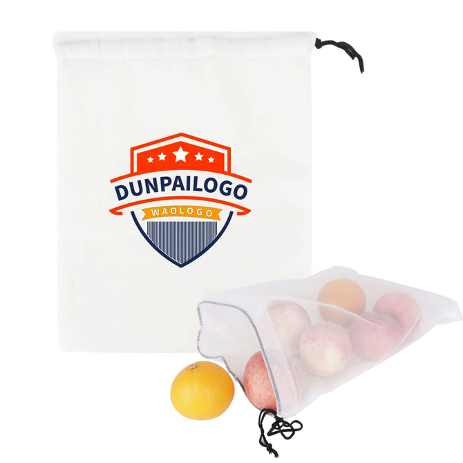 A beige cotton mesh produce bag with a drawstring, containing assorted fruits like apples and an orange.