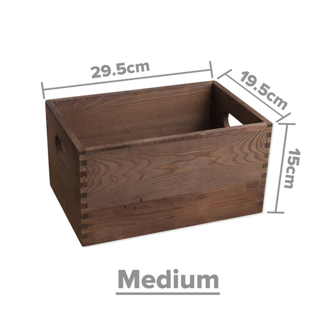 A medium wooden storage box in a warm brown colour, featuring dimensions marked on the side and handle cutouts.
