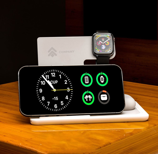 A black 3-in-1 wireless charger featuring a clock display, charging icons, and spaces for a phone and smartwatch.