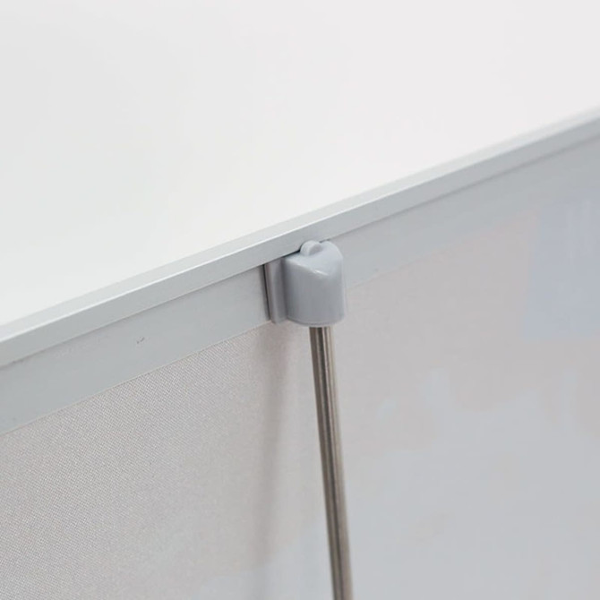 A silver pull-up banner featuring a grey support clip at the top, designed for countertop display.