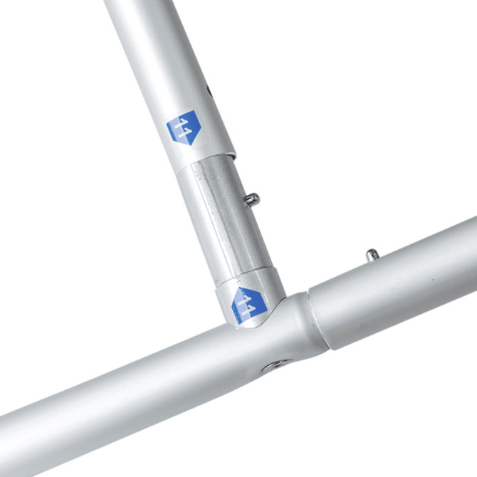 A lightweight silver frame connector for an inclined portable exhibit display wall. It features a small logo.