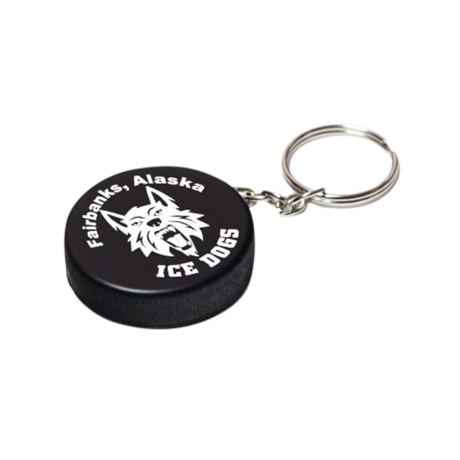 A black hockey puck stress reliever with a silver keyring and a logo featuring a wolf design.