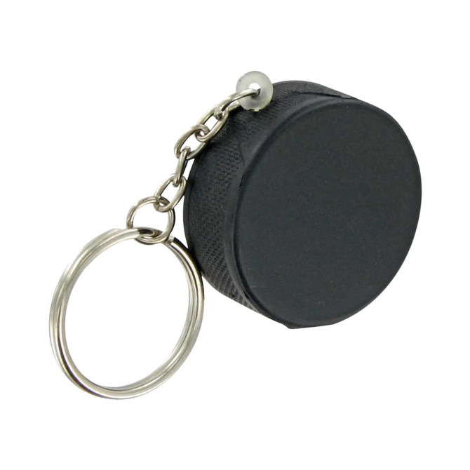 A black hockey puck stress reliever attached to a keyring with a silver chain.