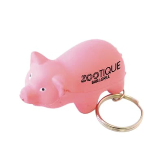 A keyring featuring a pink mini pig stress item, with a branding logo on its side.