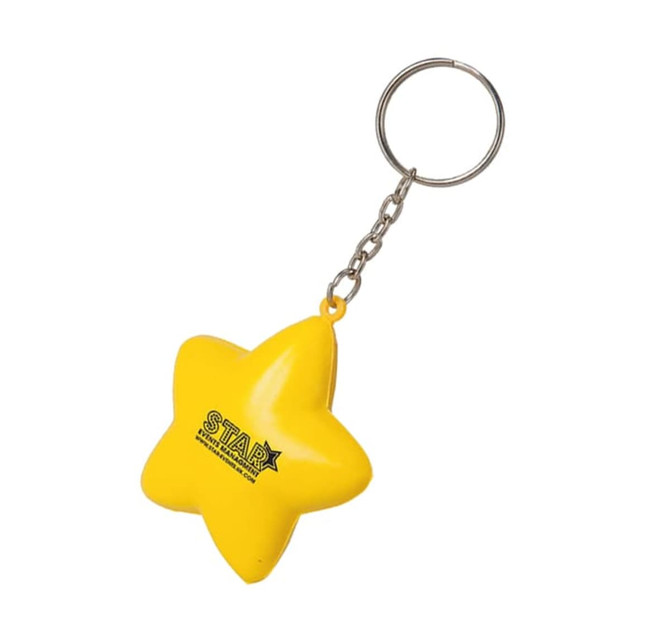 A yellow star-shaped stress reliever attached to a metal keyring. The item features a logo.