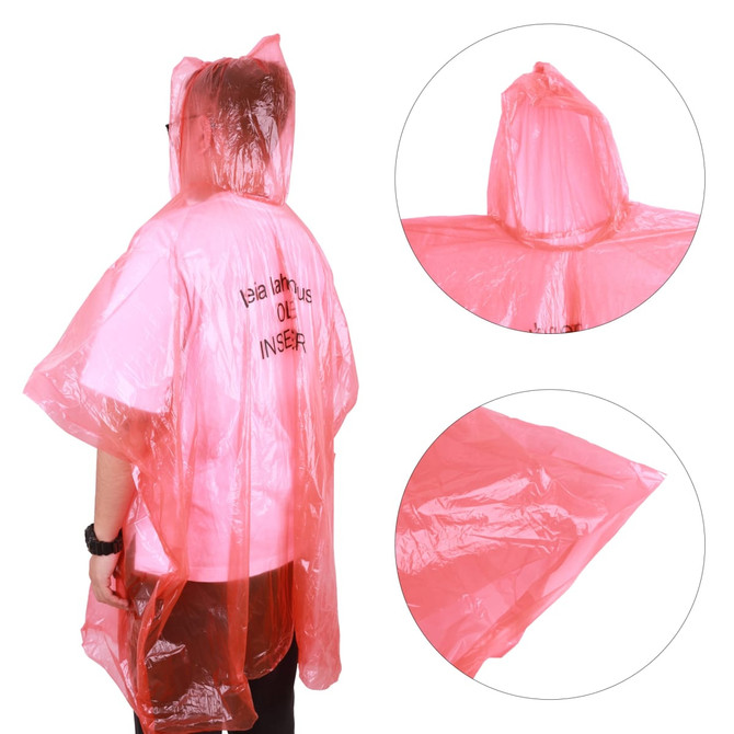 A person wears a transparent pink poncho with a hood. The fabric has a shiny, plastic appearance.
