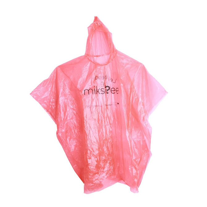 A pink poncho with a hood and a logo, made from waterproof material, hanging against a white background.