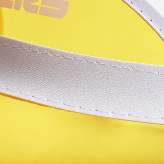 A close-up of a yellow PVC sunscreen hat featuring a white band and stitching. The hat also has a logo.