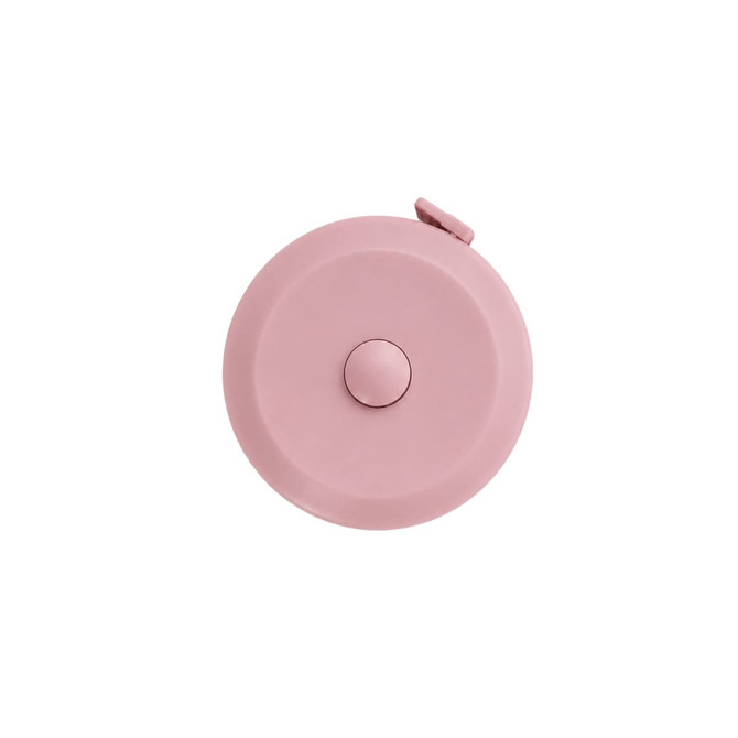 A pink round tape measure with a button on top, featuring a logo.