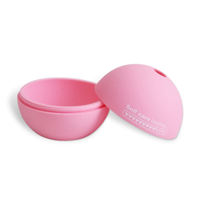 A pink silicone mould with two halves, designed for creating ice balls. It features a logo on the top.
