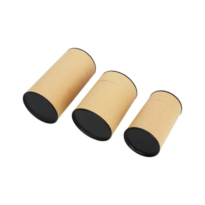 Three small kraft paper cylinders with black lids, varying in size, arranged side by side on a white background.