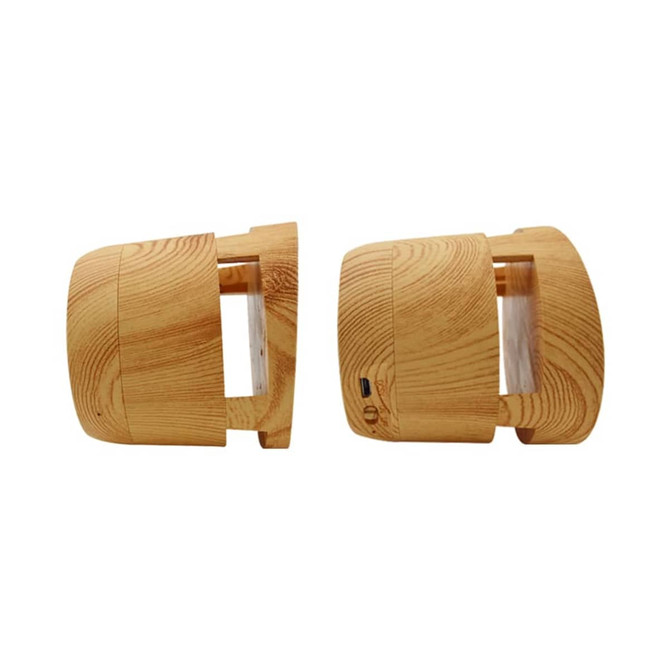 A wooden-textured Bluetooth speaker with a wireless charger feature, featuring a subtle branding logo.