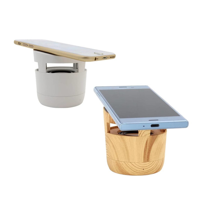 A 2 in 1 Bluetooth speaker and wireless charger in grey and wood finish, featuring a compact design and a logo.