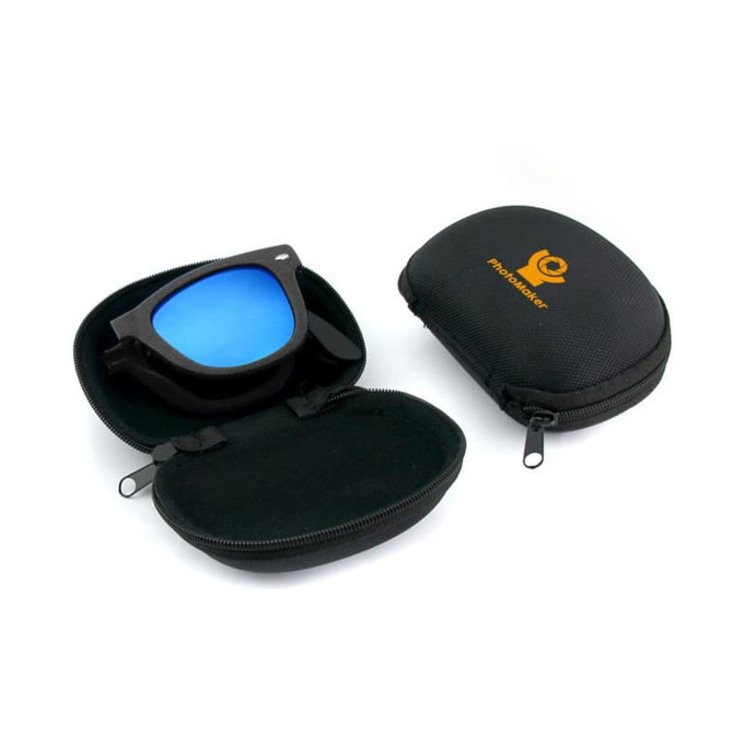 A pair of folding sunglasses with blue lenses in a black carrying case, featuring a logo on the exterior.