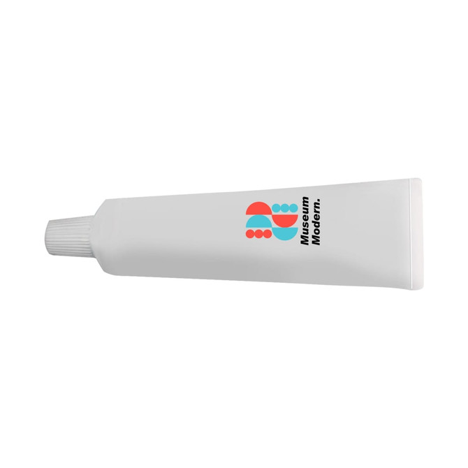 A white, tube-shaped stress reliever resembling toothpaste, featuring a logo in blue and red.