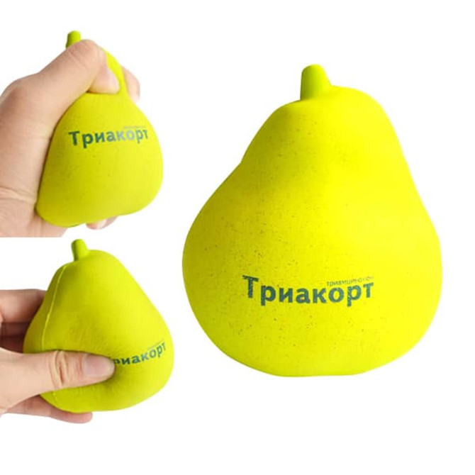 A yellow pear-shaped stress reliever held in a hand, featuring a logo on the side.