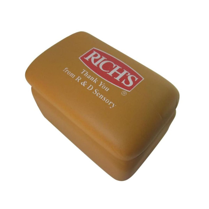 A brown toast-shaped stress reliever with a logo on the top. The product has a smooth texture and rounded edges.