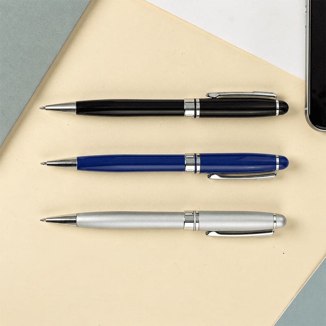 A display of three Bristol Twist ballpoint pens in black, blue, and silver, alongside a smartphone and paper background.
