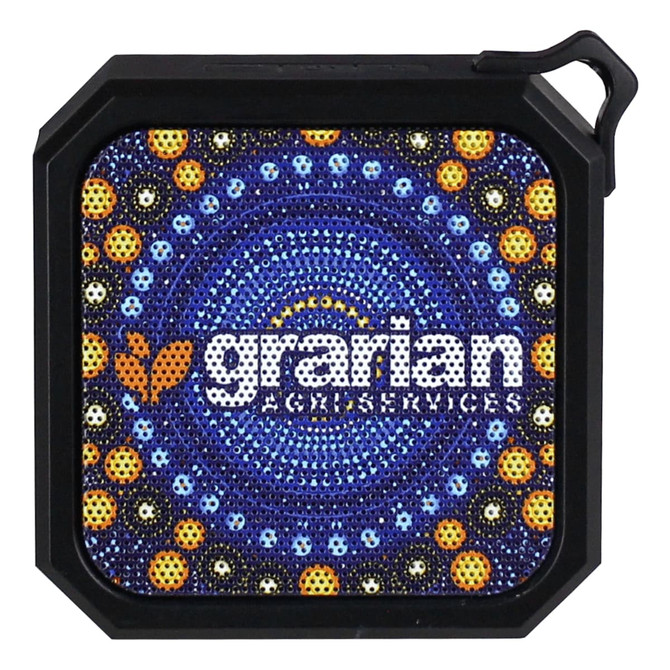 A square Bluetooth speaker with a vibrant circular pattern in blues, yellows, and oranges, featuring a logo.