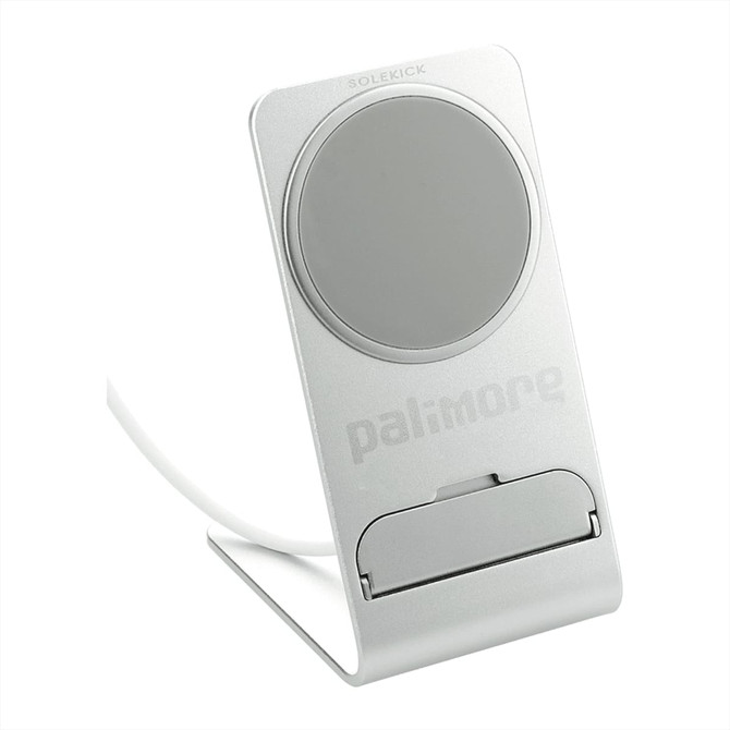 A silver wireless charging stand with a circular charging pad and a logo, designed for smartphones.