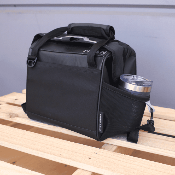 A black lunch cooler with a drink bottle pocket, featuring a logo on the side.