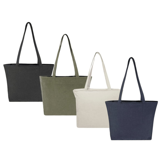 A collection of four tote bags in black, olive green, cream, and navy, each featuring long handles and a logo.