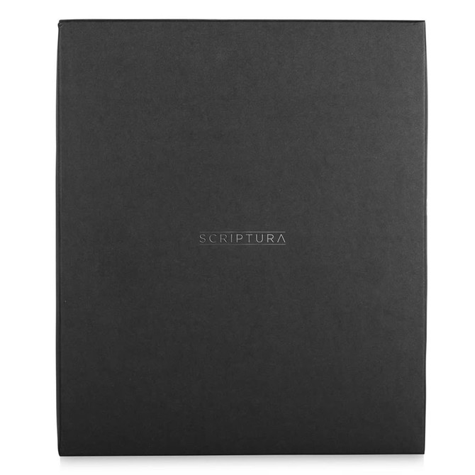 A black gift box containing the Scriptura Notebook Gift Set, featuring a branding logo on the front.