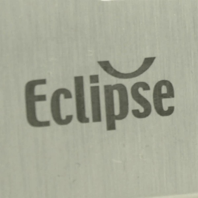 A close-up of a metallic surface featuring the word "Eclipse" in a modern font. The background is brushed aluminium.
