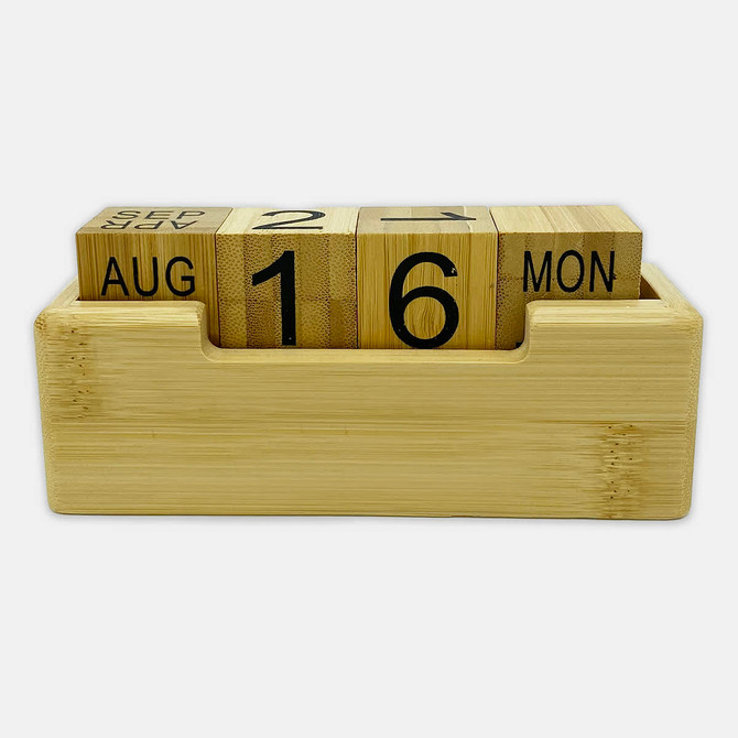 A bamboo perpetual calendar with wooden blocks displaying the date and month, housed in a rectangular base.